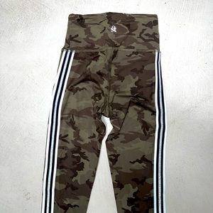 Strut This camo legging with black, white and sparkle silver stripes